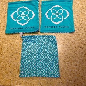 Kendra Scott draw string pouches.